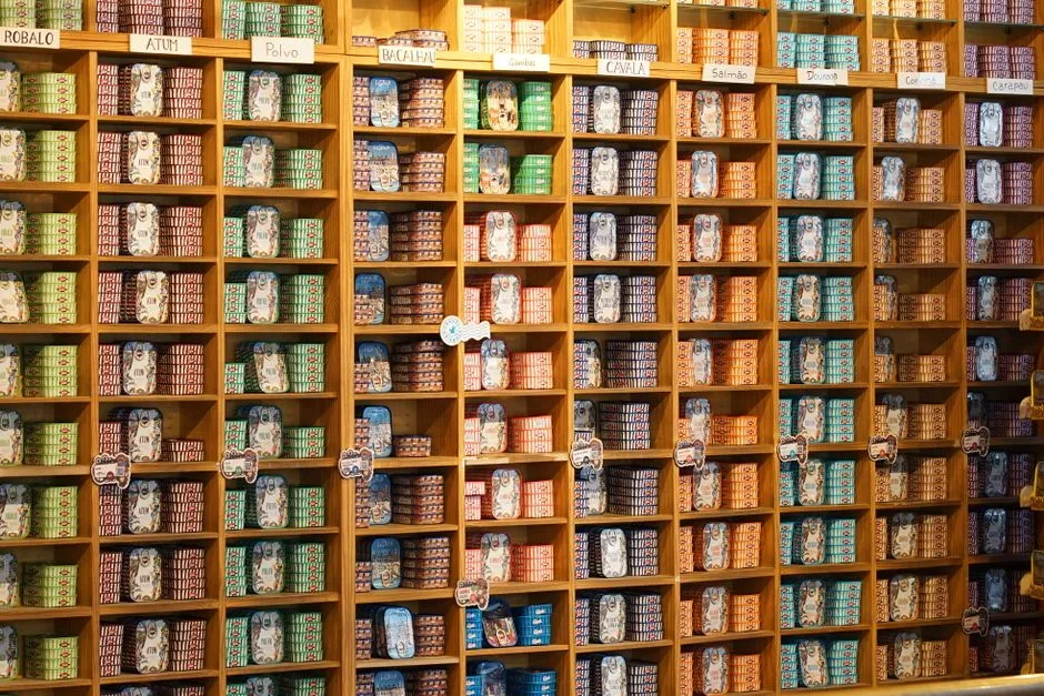 Shelves of canned and shelf-stable groceries in a store